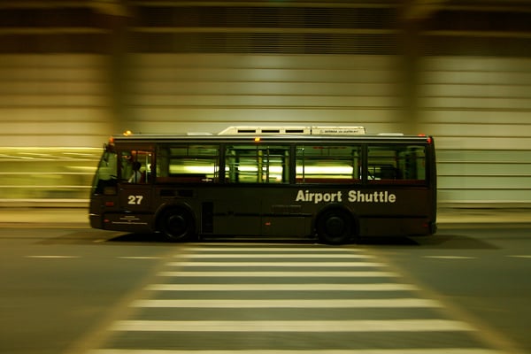 Airport shuttle bus in motion at night