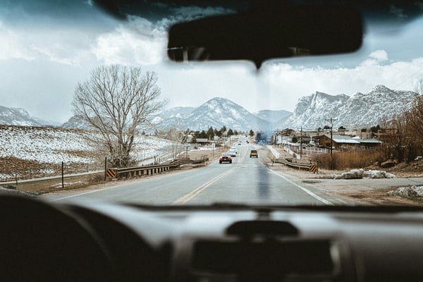POV driving through a snowy Colorado mountain valley
