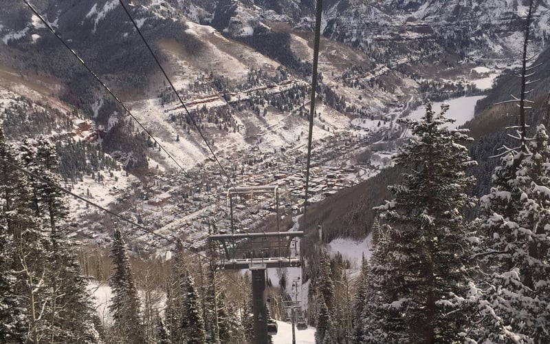 Telluride ski lift looking down the canyon to town in winter