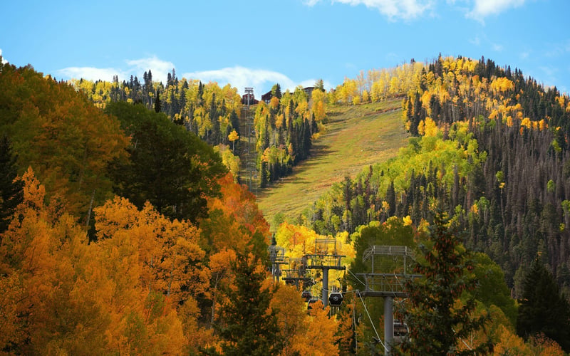 Copper Mountain ski resort with golden aspens and blue sky