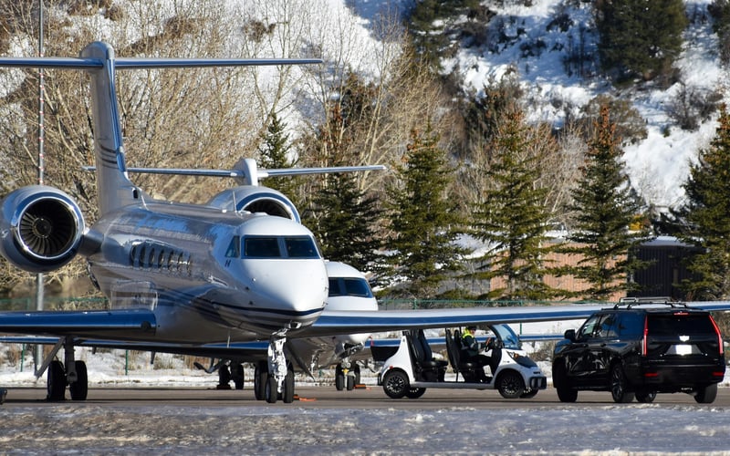Private jet on a snowy Colorado mountain airport tarmac